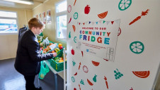 Pictured: A pupil from Co-op Failsworth Academy using a community fridge